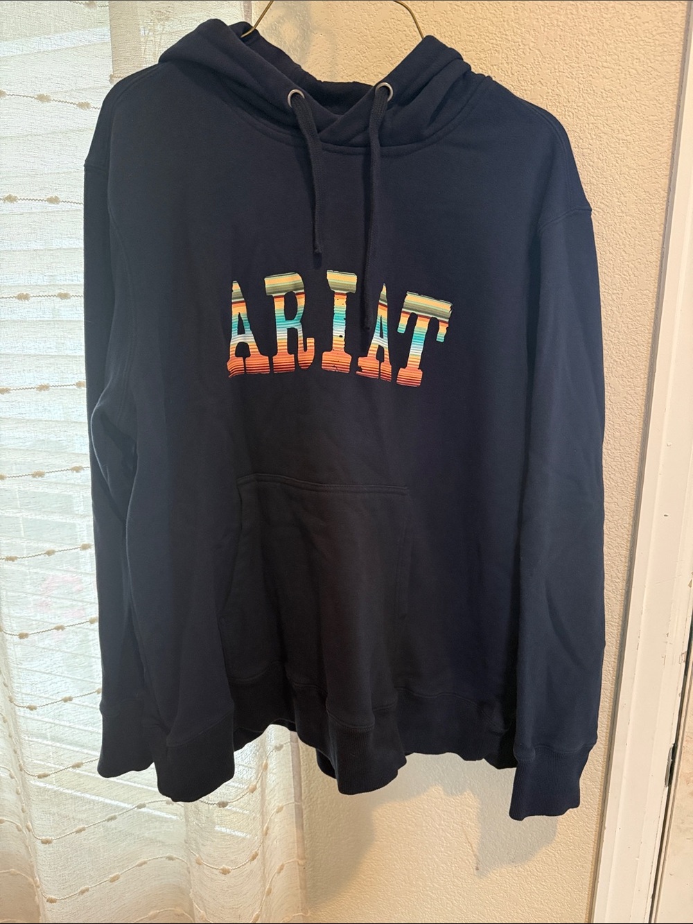 Woman’s Ariat Navy Hoodie with Multicolor Serape Lettering